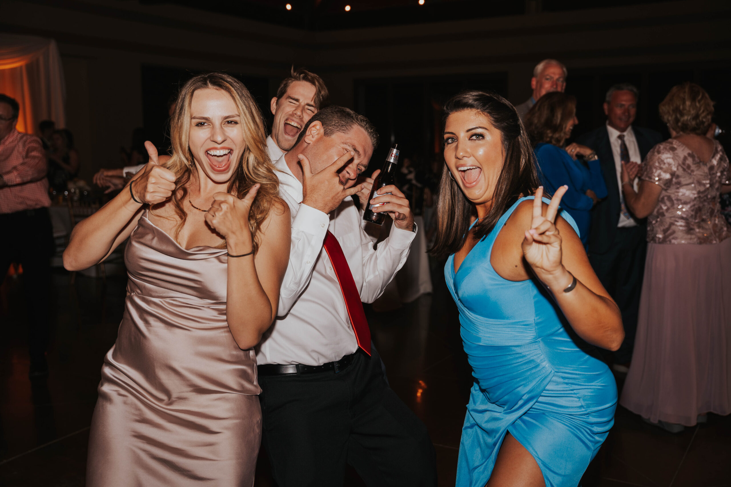 Bridal Party and Guests Dance At Wedding
