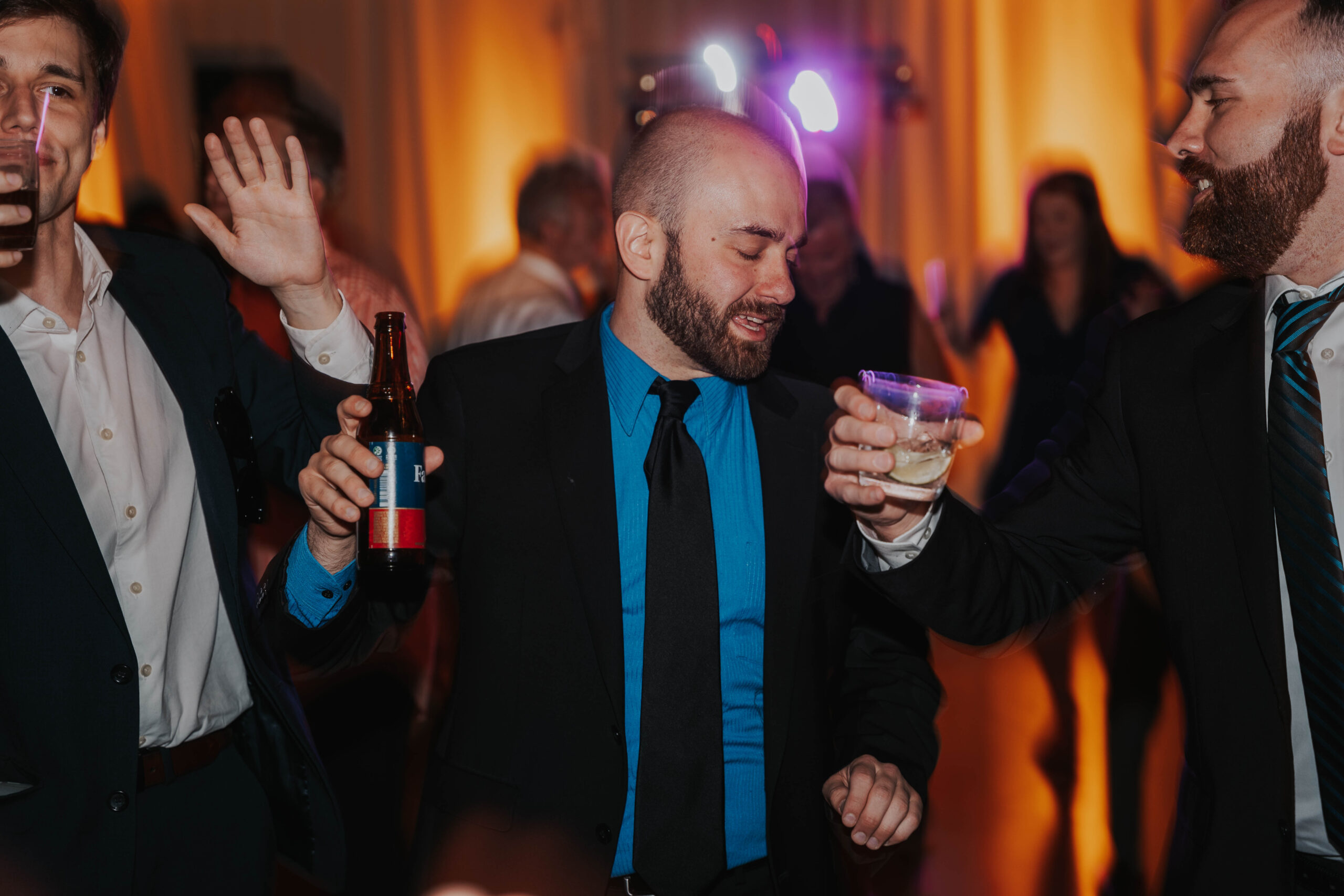Wedding Guest Drinks Beer And Dances