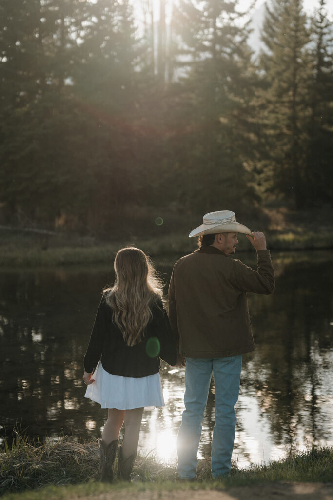 a western couple taking engagement photos in grand teton national park with a jackson hole photographer near me 